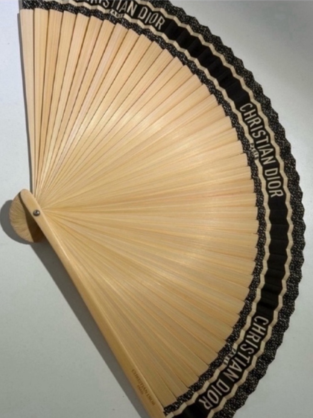 Gucci beauty holding fan